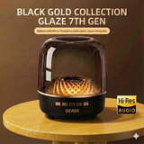 OZADE Bluetooth speaker a desktop speaker with a musical glass design features vibrant breathing light effects 360° surround sound powerful 9D bass and wireless Bluetooth connectivity.