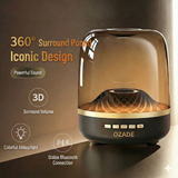 OZADE Bluetooth speaker a desktop speaker with a musical glass design features vibrant breathing light effects 360° surround sound powerful 9D bass and wireless Bluetooth connectivity.
