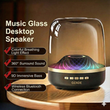 OZADE Bluetooth speaker a desktop speaker with a musical glass design features vibrant breathing light effects 360° surround sound powerful 9D bass and wireless Bluetooth connectivity.