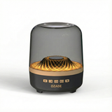 OZADE Bluetooth speaker a desktop speaker with a musical glass design features vibrant breathing light effects 360° surround sound powerful 9D bass and wireless Bluetooth connectivity.